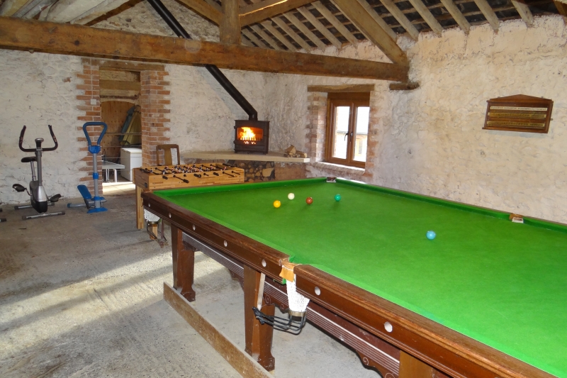 Games barn with log burner