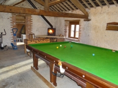 Games barn with log burner