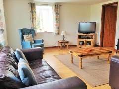 Large sitting room with sea & countryside views