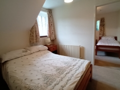 Double bedroom showing adjoining twin room